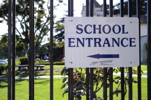 Photo: School Entrance Sign, campus security plans address the complex needs of a college campus