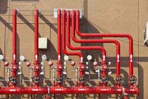 red sprinkler system valves and pipes